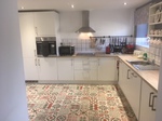 Kitchen units and floor tiles
